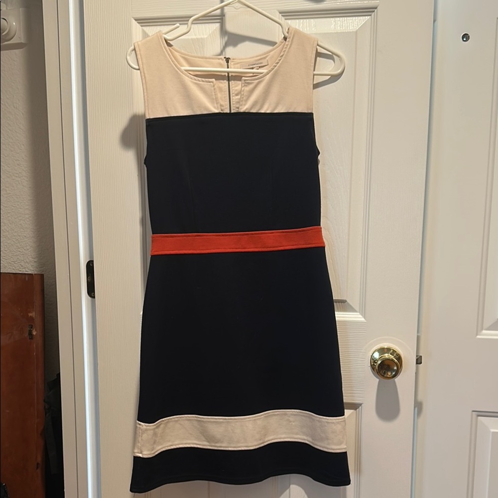 Elegant Black and Cream Dress with Red Accent